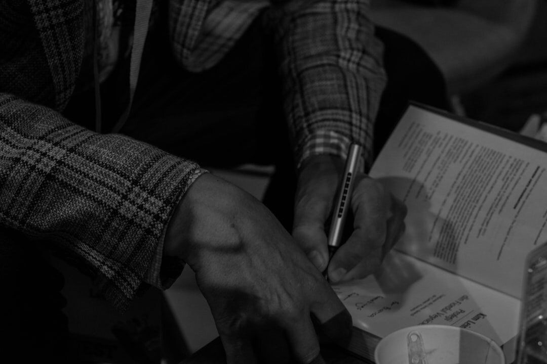 author signing book at event